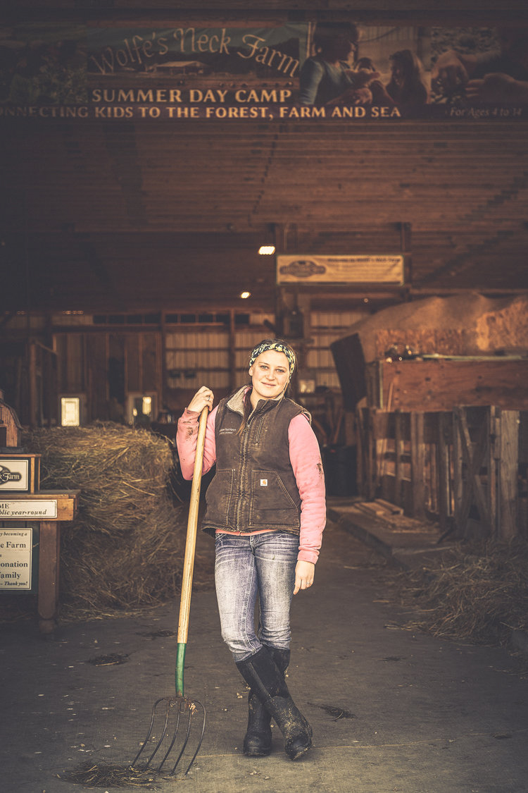 professional advertising photography farming working in the barn female farm worker barn stable